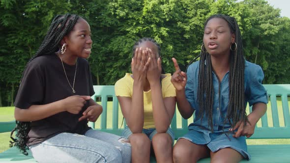 Stressed Cute Black Teenage Girls Arguing Over Something in Park alt
