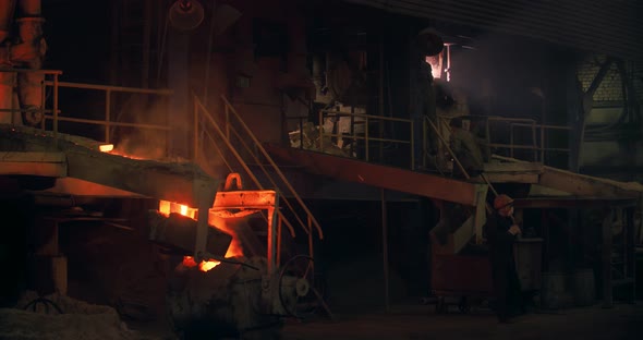 The foundry. The trolleys with the metal spark and the hot metal. It's a big factory. Metal parts.