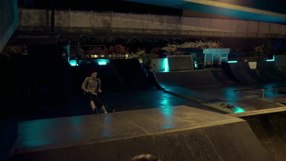 Sporty Teenage Riders Jumping Together on Scooter and Bmx Bike at Skatepark alt