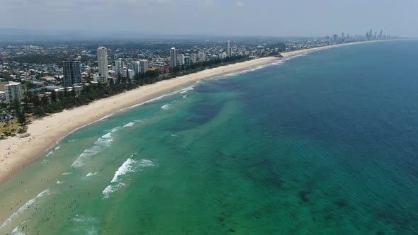 Shoreline cityscape of Burleigh Heads, Gold Coast. Establishing aerial alt