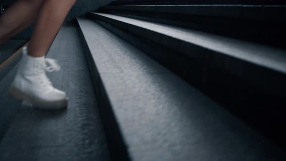 Girl Legs Walking Stairs in Subway Underground Station at City Street alt