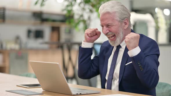 Senior Old Businessman Celebrating Success on Laptop alt