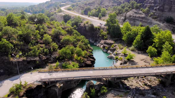 Aero. View From Above. Beautiful Landscape, in the Midst of Mountains and Trees, in Gorge There Is a alt