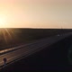 Police Car With Flashes Of Beacons Driving On The Highway At Sunset 01 - VideoHive Item for Sale