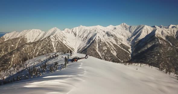 Actionsportlers were dropped by a helicopter at the top of the mountains. Drone shooting. alt