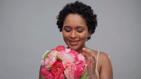 Young African American Woman with Bunch of Flowers alt