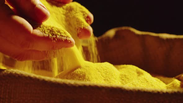 Corn Flour Texture Closeup Cornmeal on Black Background alt