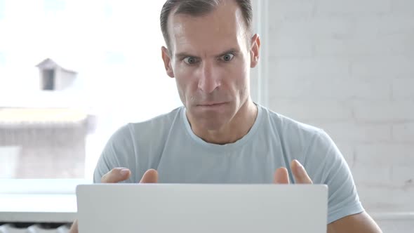 Angry Man Reacting to Loss at Work alt