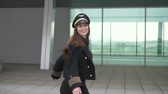 Happiness Lifestyle Portrait of Young Attractive Woman Pilot Dancing alt