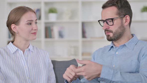 Portrait of Cheerful Young Man Talking To His Partner  alt