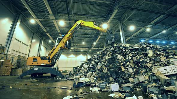 Junkyard Unit with a Transporter Relocating Rubbish. Garbage, Trash, Waste Recycling Factory. alt