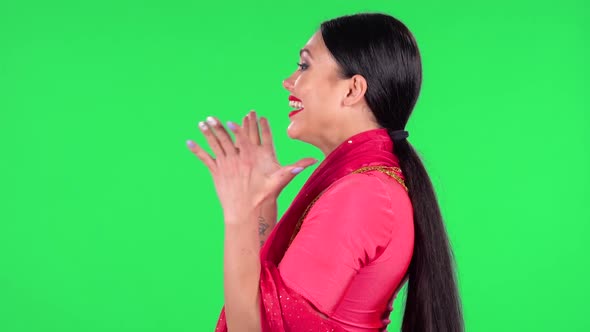 Portrait of a Young Indian Girl in National Classic Red Sari Is Looking Straight with Very Happy  alt