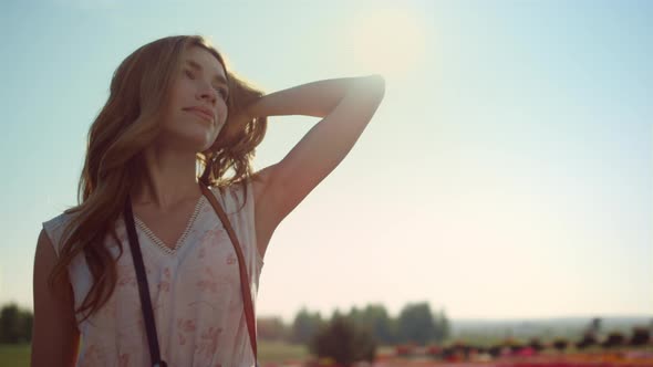 Portrait of Beautiful Woman Enjoying Sun in Summer Day alt