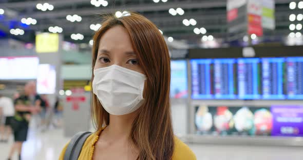 Woman wear medical face mask at airport