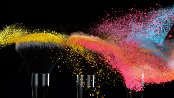 Super Slow Motion Shot of Colorful Powder and Makeup Brushes Touch Each Other at 1000 Fps alt