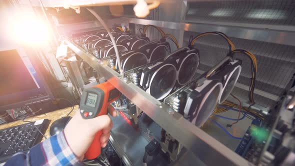 A Worker Checks Processors, Close Up. alt