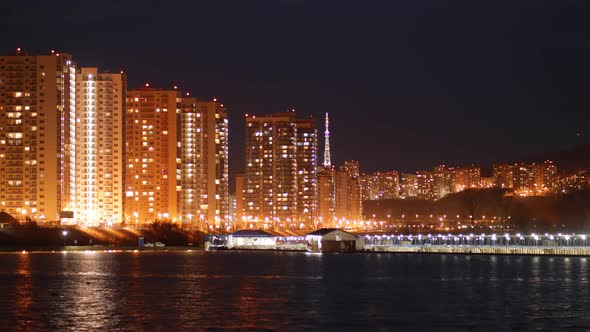 Time Lapse of the Lights of the Night City on the Coast alt