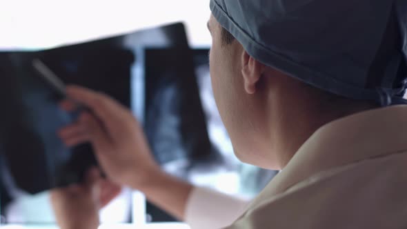 Doctor Looks at X-Ray alt