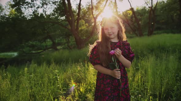 Young Child in Field with Flowers