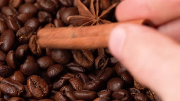 Barista Mixes Coffee Beans With A Cinnamon Stick