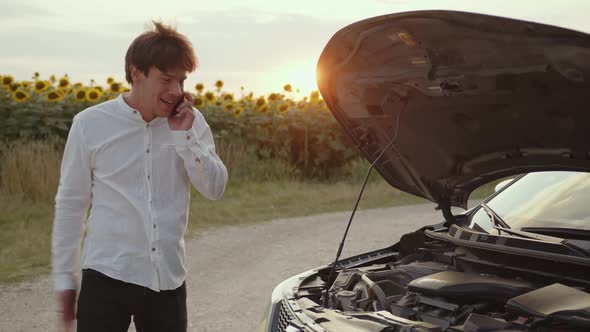 Man Stands and Explains the Car's Breakdown alt