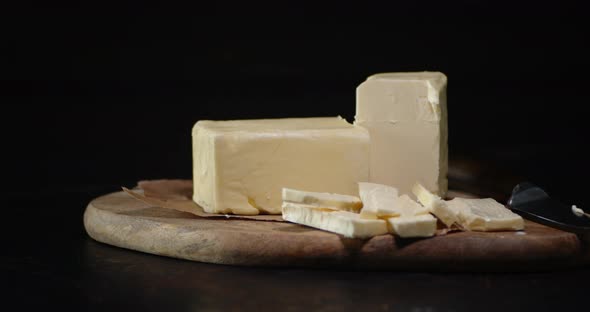 The Sliced Butter on a Round Board Slowly Rotates. alt
