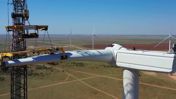 Construction Workers Are Assembling a Wind Turbine, High Altitude Work,  alt