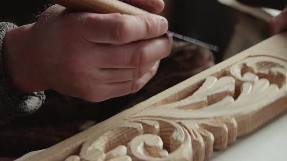 Closeup shoot of a woodcarver at work