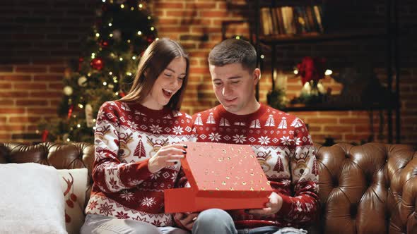 Woman is Surprised and Excited After Opening Received Gift Box