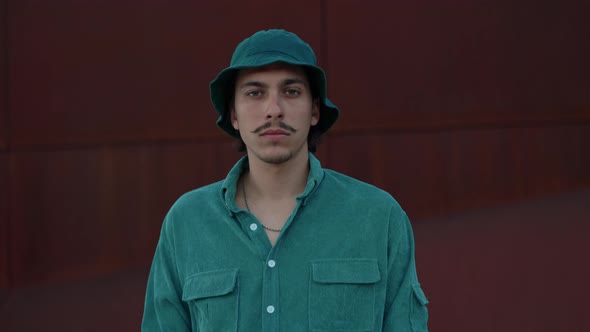 Portrait of Young Guy Using Smartphone on City Street alt