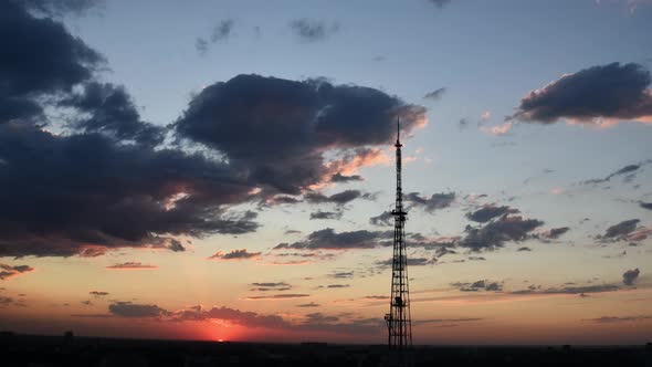 Time Lapse Dramatic Sky with Floating Purple Clouds and 4G Communication Tower