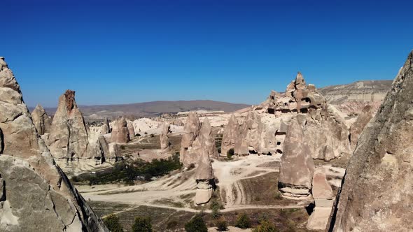 Aerial Mesmerizing View of Natural Formations of Mountains in Cappadocia Taken From Air alt