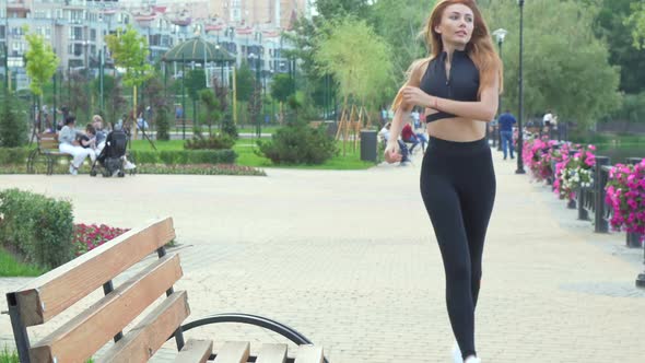 Gorgeous Fit Woman Resting on the Bench After Jogging
