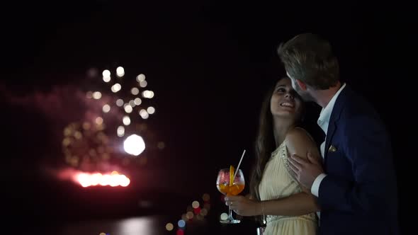Couple Kissing Fireworks in Background