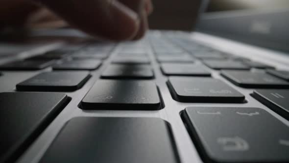 Close-up time lapse typing on keyboard with fingers. Macro soft focus dolly shot alt