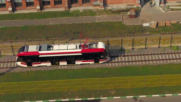 A Modern Electric Tram Is Speeding on the Rails in Europe alt