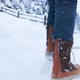 Close Up View on Red Brown Snow Boots Walking By Fresh White Snow in Countryside - VideoHive Item for Sale