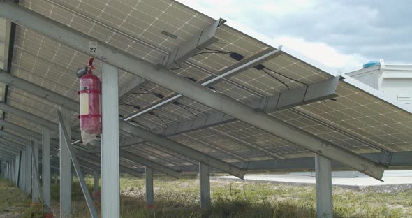 Fire Extinguisher on the Back of a Solar Panel Safety Solar Power Station alt