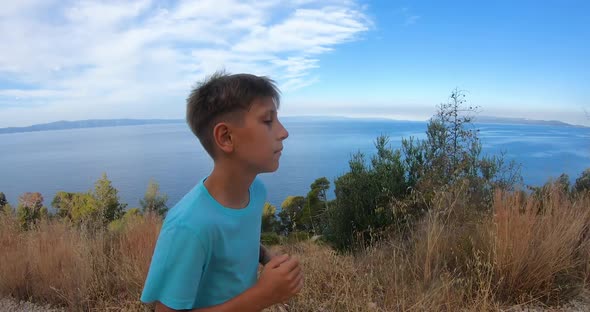 Kid 10 - 11Years Old Athletic Boy Running on Rural Road During Sunrise at Sun Dawn Over sea alt