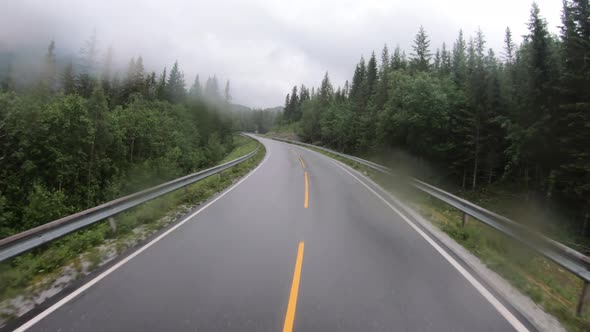 View From the Car in the Rain Driving on Wet Roads alt