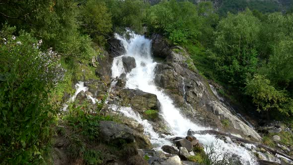 View of Waterfall Scenes in Mountains, National Park Dombay, Caucasus, Russia