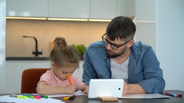 Father and Girl Learn to Draw Watching Drawing Lesson on Internet