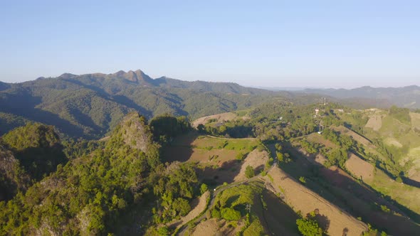 Aerial top view of forest trees and green mountain hills. Nature landscape background, Thailand. alt