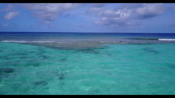 Aerial flying over tourism of tranquil lagoon beach trip by aqua blue water with bright sand backgro alt
