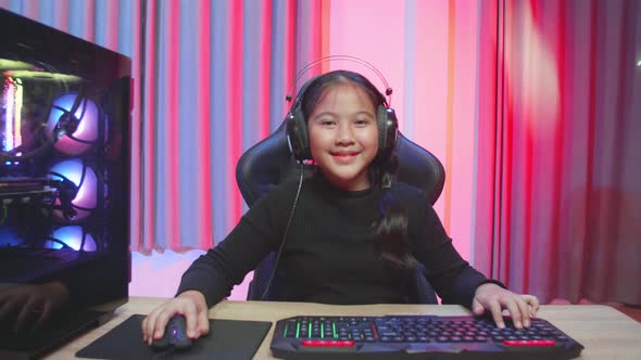 Asian Young Woman Controlling Console With Mouse And Keyboard Win Video Game alt