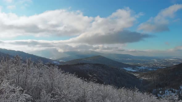 Hyperlapse.Beatifull and smooth fly above winter forest and mountains.