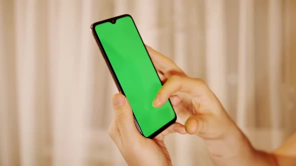 Hand of a Man with a Mobile Phone Touch Screen Close Up Chrome Key alt