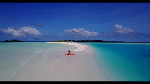 Boy and girl sunbathe on exotic sea view beach voyage by transparent water and white sandy backgroun alt