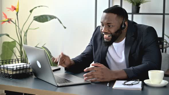 Annoyed Angry African American Businessman Manager Has an Unpleasant Conversation Via Video alt