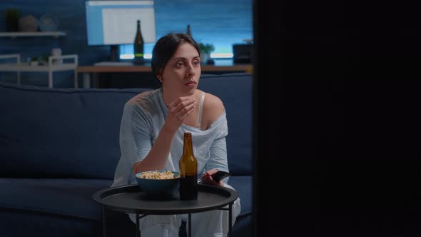 Emotional Young Woman Eating Popcorn While Watching Disgusting Tv Movie alt
